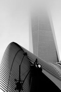Preview wallpaper skyscraper, fog, roof, spotlight, black and white