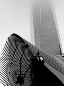 Preview wallpaper skyscraper, fog, roof, spotlight, black and white