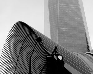 Preview wallpaper skyscraper, fog, roof, spotlight, black and white