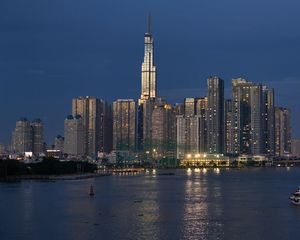 Preview wallpaper skyscraper, tower, buildings, river, lights, city