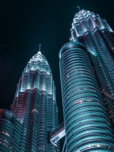 Preview wallpaper skyscrapers, architecture, backlight, view from below, night