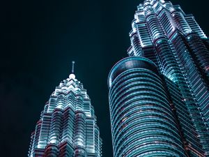 Preview wallpaper skyscrapers, architecture, backlight, view from below, night