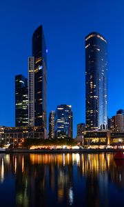 Preview wallpaper skyscrapers, architecture, reflection, lights, night