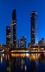 Preview wallpaper skyscrapers, architecture, reflection, lights, night