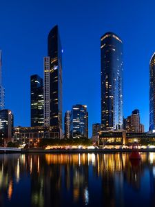 Preview wallpaper skyscrapers, architecture, reflection, lights, night