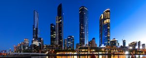 Preview wallpaper skyscrapers, architecture, reflection, lights, night
