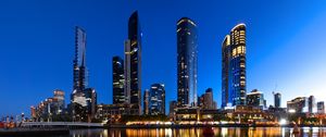 Preview wallpaper skyscrapers, architecture, reflection, lights, night