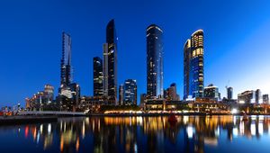 Preview wallpaper skyscrapers, architecture, reflection, lights, night