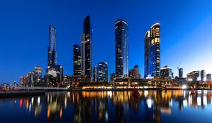 Preview wallpaper skyscrapers, architecture, reflection, lights, night