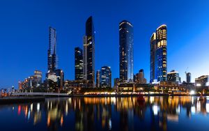 Preview wallpaper skyscrapers, architecture, reflection, lights, night