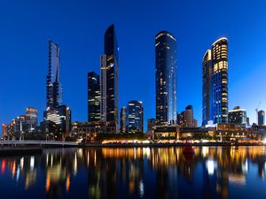 Preview wallpaper skyscrapers, architecture, reflection, lights, night