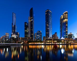 Preview wallpaper skyscrapers, architecture, reflection, lights, night