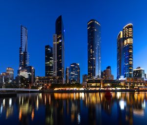 Preview wallpaper skyscrapers, architecture, reflection, lights, night