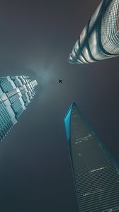Preview wallpaper skyscrapers, bottom view, plane, minimalism