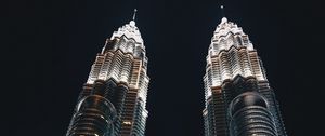 Preview wallpaper skyscrapers, bottom view, towers, architecture, lighting, metropolis