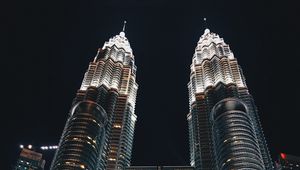 Preview wallpaper skyscrapers, bottom view, towers, architecture, lighting, metropolis