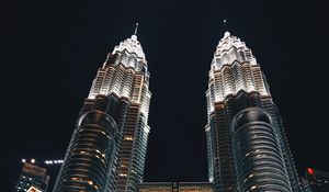 Preview wallpaper skyscrapers, bottom view, towers, architecture, lighting, metropolis