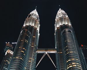 Preview wallpaper skyscrapers, bottom view, towers, architecture, lighting, metropolis