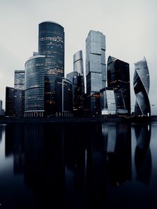 Preview wallpaper skyscrapers, buildings, architecture, water, reflection