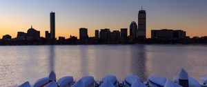 Preview wallpaper skyscrapers, buildings, boats, water, sunset