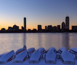 Preview wallpaper skyscrapers, buildings, boats, water, sunset