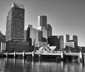 Preview wallpaper skyscrapers, buildings, bridge, river, city, black and white