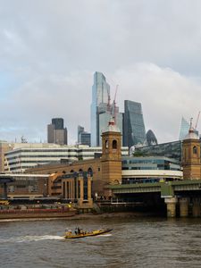 Preview wallpaper skyscrapers, buildings, bridge, river, boat, city