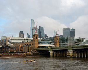 Preview wallpaper skyscrapers, buildings, bridge, river, boat, city