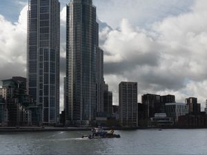 Preview wallpaper skyscrapers, buildings, city, sea, ship, clouds