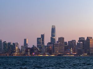 Preview wallpaper skyscrapers, buildings, city, dusk, sea