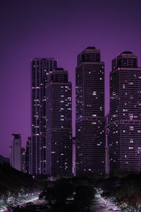 Preview wallpaper skyscrapers, buildings, city, night, dark, purple