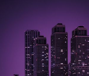 Preview wallpaper skyscrapers, buildings, city, night, dark, purple
