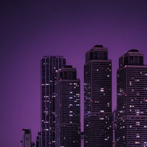 Preview wallpaper skyscrapers, buildings, city, night, dark, purple