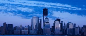 Preview wallpaper skyscrapers, buildings, city, sky, blue, evening