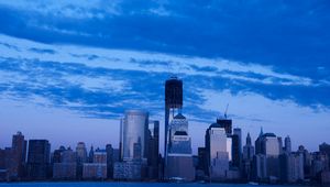 Preview wallpaper skyscrapers, buildings, city, sky, blue, evening