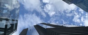 Preview wallpaper skyscrapers, buildings, clouds, bottom view, blue