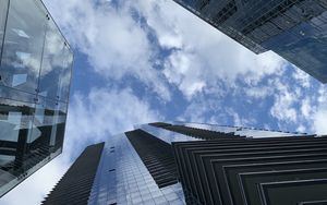 Preview wallpaper skyscrapers, buildings, clouds, bottom view, blue