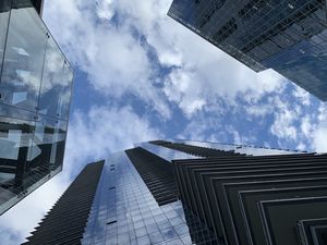 Preview wallpaper skyscrapers, buildings, clouds, bottom view, blue