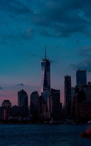 Preview wallpaper skyscrapers, buildings, coast, city, dusk, evening