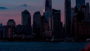 Preview wallpaper skyscrapers, buildings, coast, city, dusk, evening