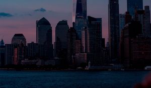 Preview wallpaper skyscrapers, buildings, coast, city, dusk, evening