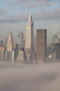 Preview wallpaper skyscrapers, buildings, fog, city