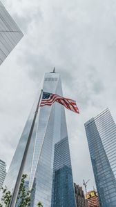 Preview wallpaper skyscrapers, buildings, glass, architecture, flag, usa