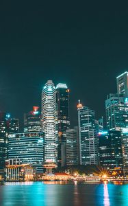 Preview wallpaper skyscrapers, buildings, night city, beach