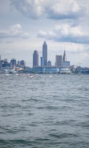 Preview wallpaper skyscrapers, buildings, sea, water, city, clouds