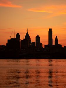 Preview wallpaper skyscrapers, buildings, silhouette, sunset, sea