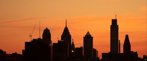 Preview wallpaper skyscrapers, buildings, silhouette, sunset, sea