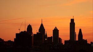 Preview wallpaper skyscrapers, buildings, silhouette, sunset, sea