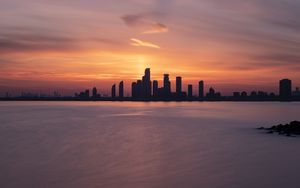 Preview wallpaper skyscrapers, buildings, silhouettes, city, sea