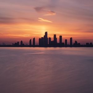 Preview wallpaper skyscrapers, buildings, silhouettes, city, sea